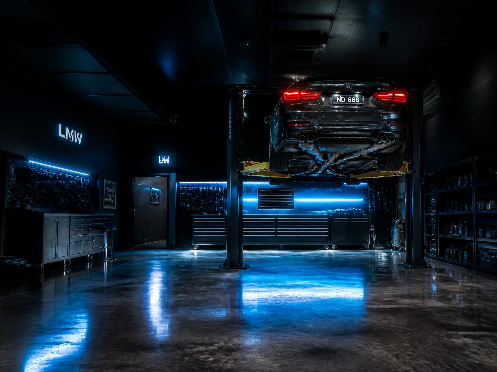 Vehicle raised on a lift inside the iFix Cars service bay